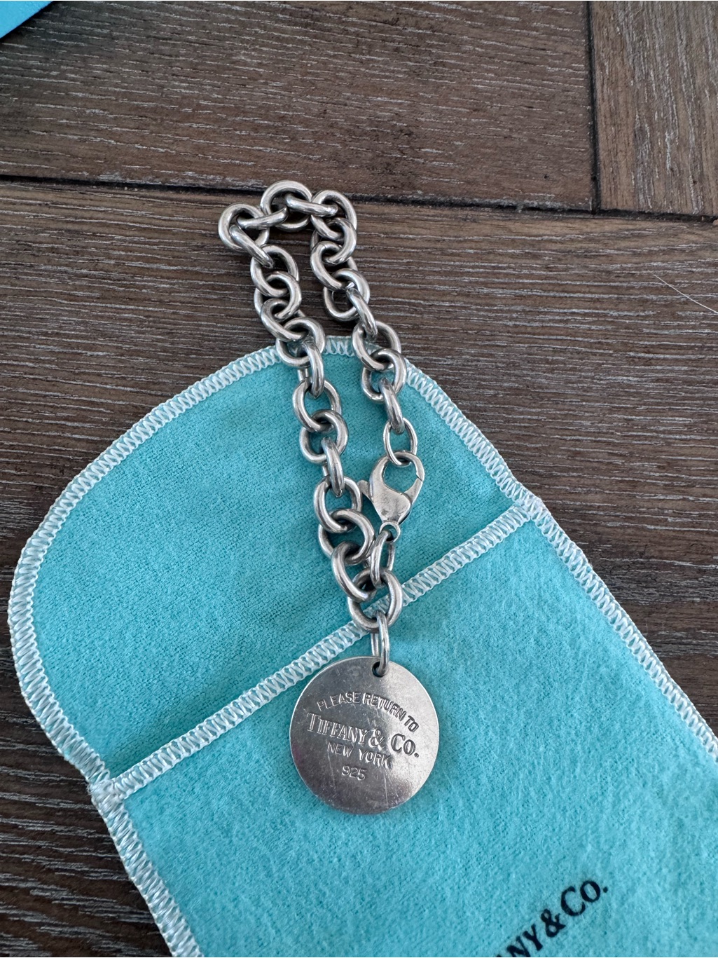 Tiffany & Co. Sterling Silver Round Tag Bracelet With Blue Pouch